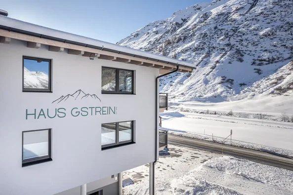 Haus Gstrein in Obergurgl in winter, set against a snow-covered mountain backdrop